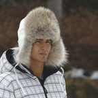 Coyote Fur Winter Hat Aviator with White Leather on Man in the woods